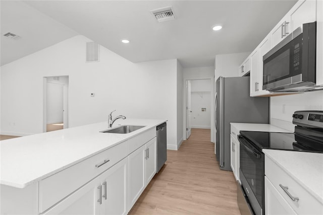 2300 Nordendale Blvd, North Port, FL 34288 - kitchen featuring appliances with stainless steel finishes, a sink, white cabinets, light countertops, and recessed lighting