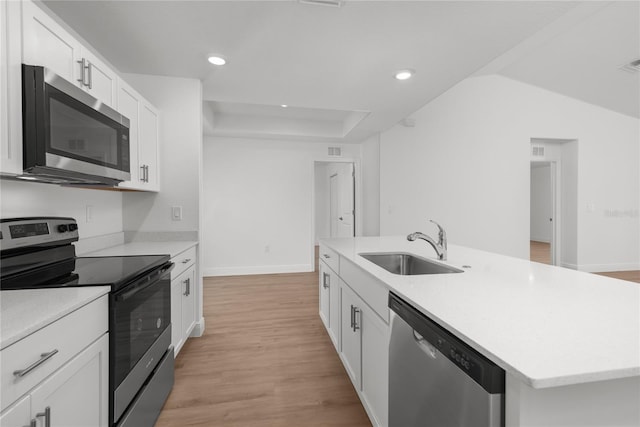 2300 Nordendale Blvd, North Port, FL 34288 - kitchen featuring stainless steel appliances, a sink, light wood-style floors, white cabinets, and recessed lighting