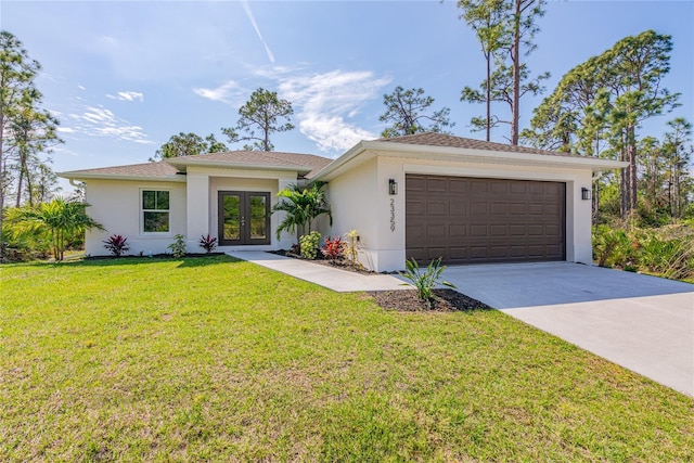 2300 Nordendale Blvd, North Port, FL 34288 - view of front facade featuring french doors, stucco siding, concrete driveway, and an attached garage