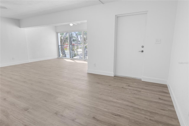 6500 Estero Blvd Unit F116, Fort Myers Beach, FL 33931 - empty room featuring wood finished floors and baseboards