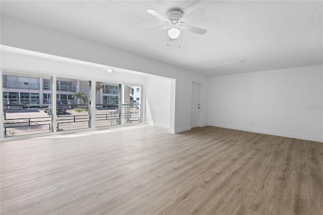 6500 Estero Blvd Unit F116, Fort Myers Beach, FL 33931 - unfurnished living room featuring wood finished floors and a ceiling fan