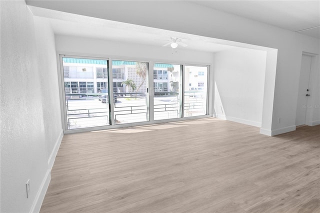 6500 Estero Blvd Unit F116, Fort Myers Beach, FL 33931 - spare room with light wood finished floors, a ceiling fan, and a textured wall