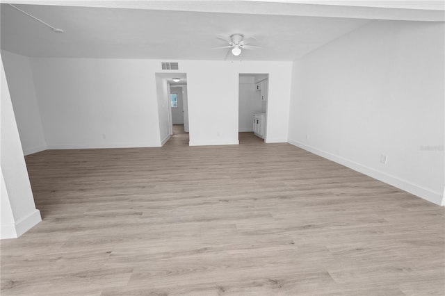 6500 Estero Blvd Unit F116, Fort Myers Beach, FL 33931 - empty room featuring a ceiling fan and light wood finished floors