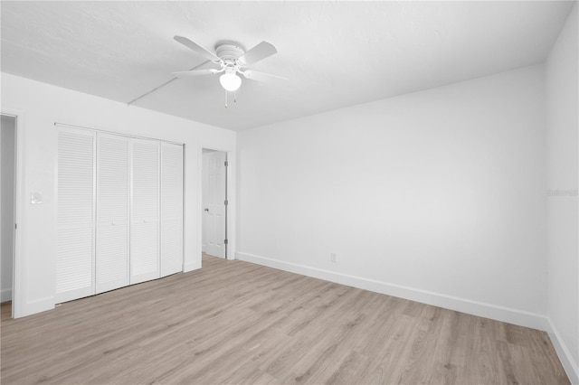 6500 Estero Blvd Unit F116, Fort Myers Beach, FL 33931 - unfurnished bedroom with a closet, light wood-style floors, and a ceiling fan