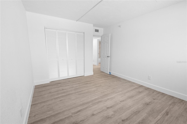 6500 Estero Blvd Unit F116, Fort Myers Beach, FL 33931 - unfurnished bedroom with a closet and wood finished floors