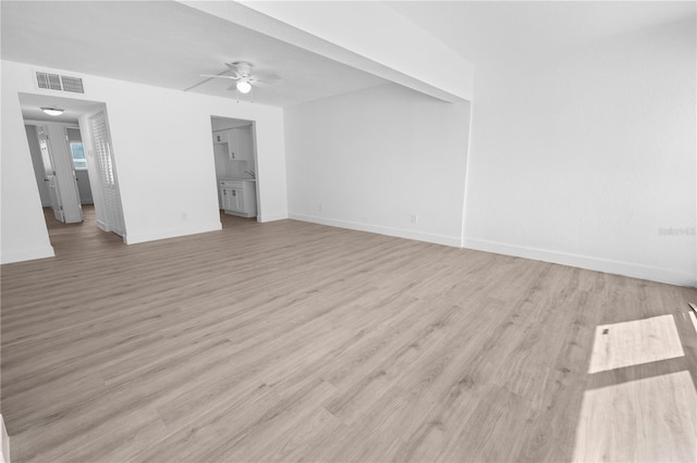 6500 Estero Blvd Unit F116, Fort Myers Beach, FL 33931 - unfurnished living room featuring ceiling fan and light wood finished floors