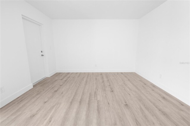 6500 Estero Blvd Unit F116, Fort Myers Beach, FL 33931 - empty room with light wood-style flooring and baseboards