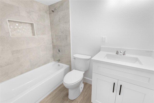 6500 Estero Blvd Unit F116, Fort Myers Beach, FL 33931 - bathroom featuring vanity, wood finished floors, and tub / shower combination