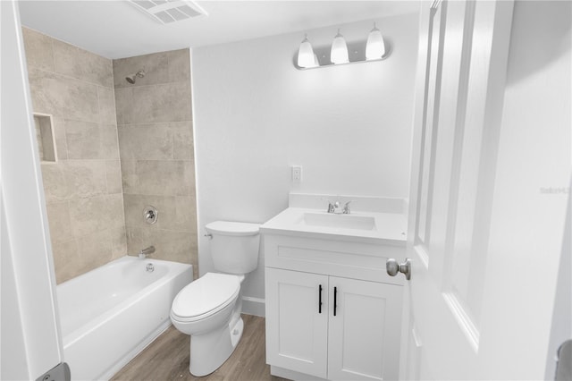 6500 Estero Blvd Unit F116, Fort Myers Beach, FL 33931 - bathroom featuring wood finished floors, vanity, and tub / shower combination