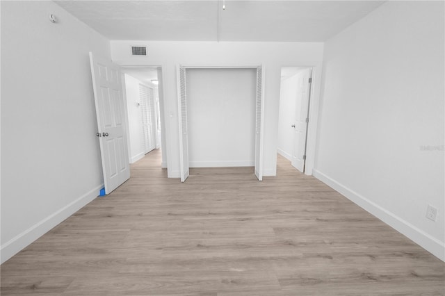 6500 Estero Blvd Unit F116, Fort Myers Beach, FL 33931 - unfurnished bedroom with a closet and light wood-style floors