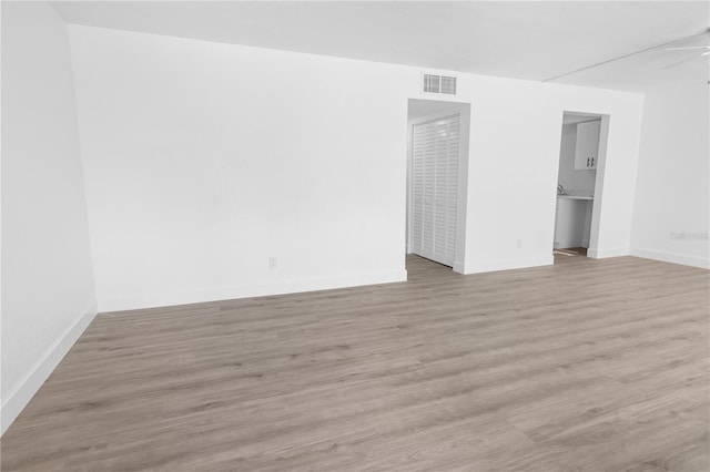 6500 Estero Blvd Unit F116, Fort Myers Beach, FL 33931 - spare room featuring baseboards and light wood-style flooring