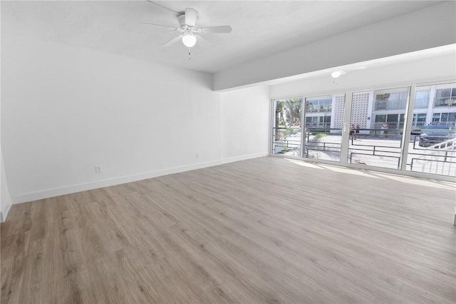 6500 Estero Blvd Unit F116, Fort Myers Beach, FL 33931 - spare room featuring wood finished floors and a ceiling fan