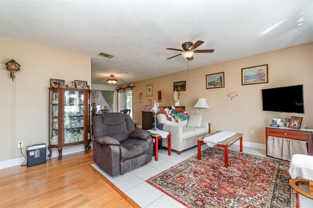 402 Cicero St NW, Port Charlotte, FL 33948 - living area with baseboards, light wood-style flooring, ceiling fan, and visible vents