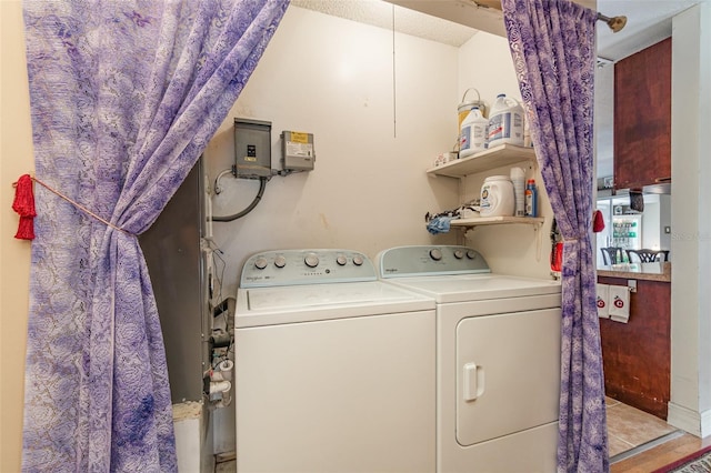 402 Cicero St NW, Port Charlotte, FL 33948 - laundry room with laundry area and washer and clothes dryer