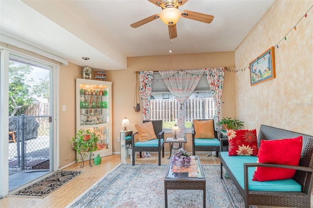 402 Cicero St NW, Port Charlotte, FL 33948 - living area featuring baseboards, ceiling fan, and wood finished floors