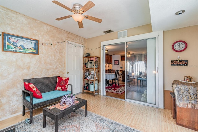 402 Cicero St NW, Port Charlotte, FL 33948 - living area featuring a ceiling fan and visible vents