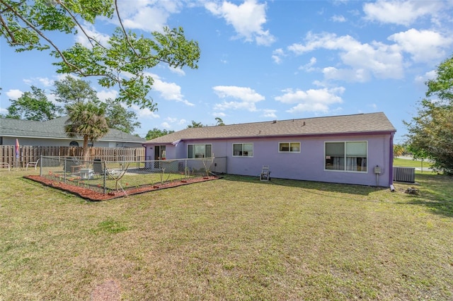 402 Cicero St NW, Port Charlotte, FL 33948 - back of house with a lawn, fence, and stucco siding