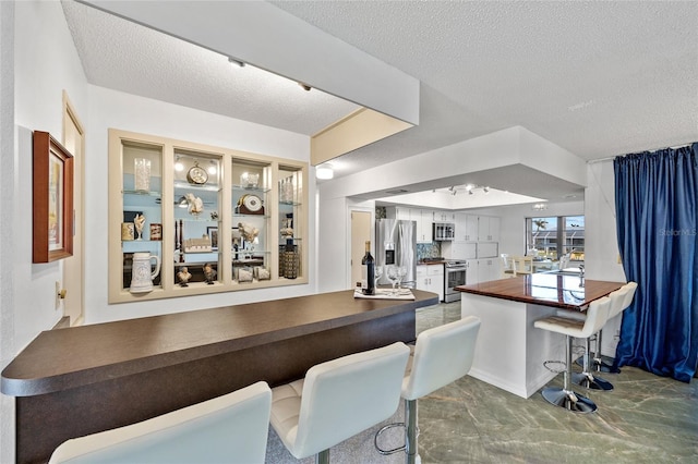 interior space featuring a textured ceiling