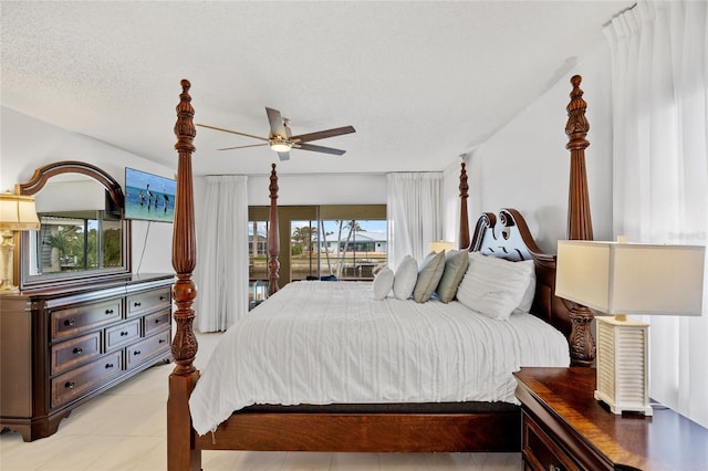 bedroom with a textured ceiling and ceiling fan