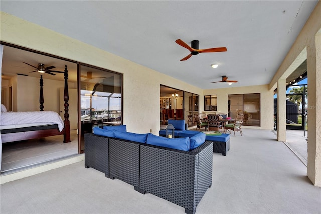 view of patio featuring outdoor lounge area, ceiling fan, and a lanai