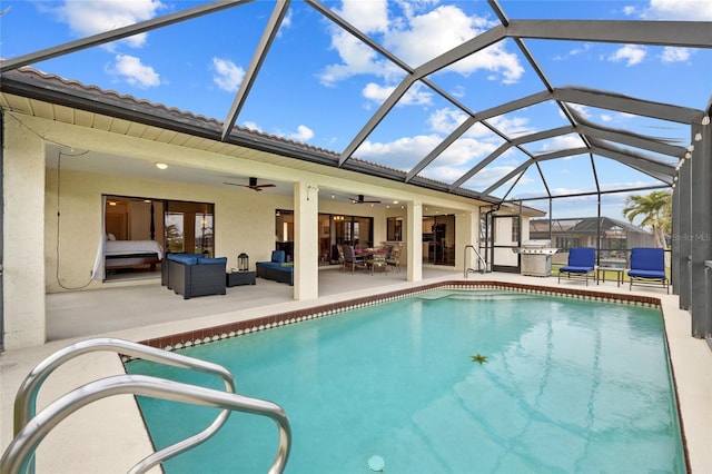 outdoor pool with a grill, glass enclosure, a ceiling fan, outdoor lounge area, and a patio area