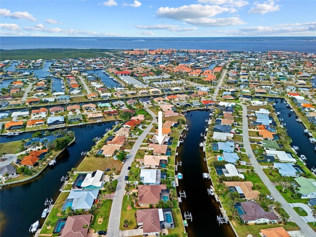 aerial view with a residential view and a water view