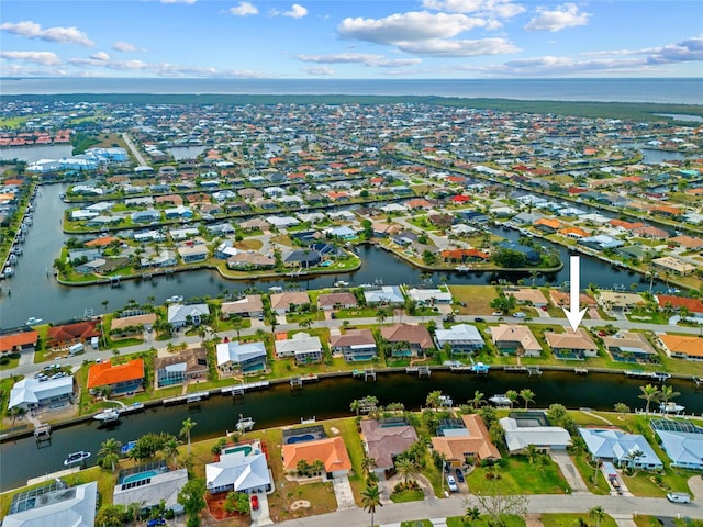 bird's eye view featuring a residential view and a water view