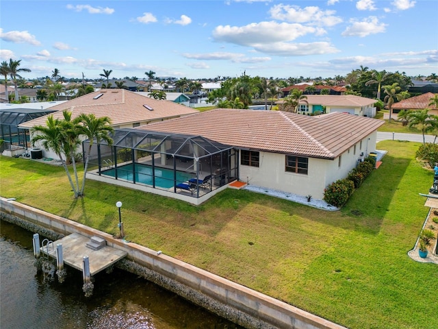 drone / aerial view with a water view and a residential view