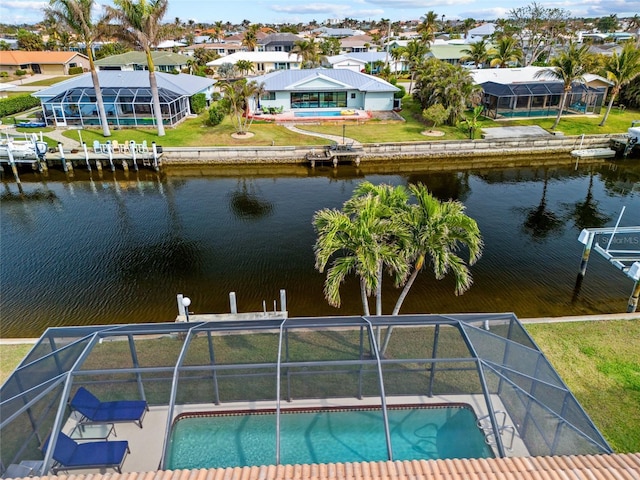 drone / aerial view with a residential view and a water view