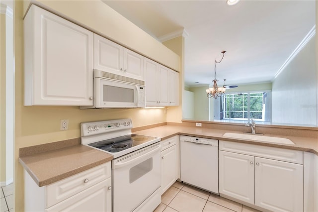 11291 Wine Palm Rd, Fort Myers, FL 33966 - kitchen with a sink, a chandelier, light tile patterned floors, white appliances, and ornamental molding
