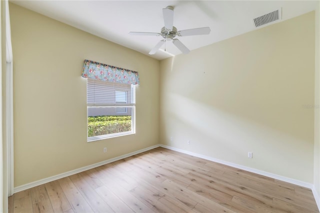 11291 Wine Palm Rd, Fort Myers, FL 33966 - unfurnished room with wood finished floors, baseboards, ceiling fan, and visible vents