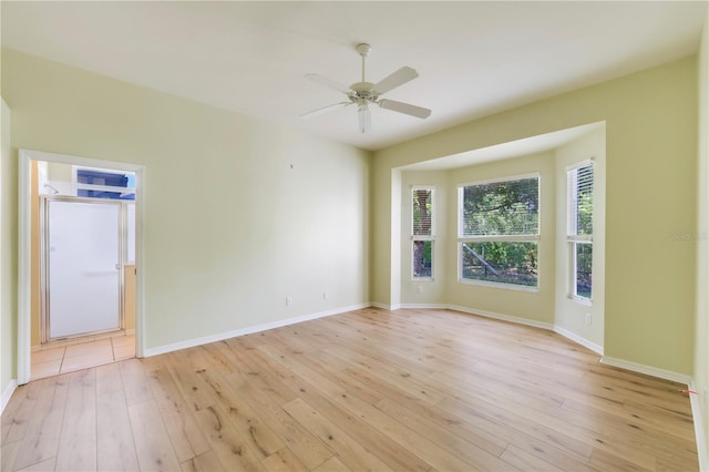 11291 Wine Palm Rd, Fort Myers, FL 33966 - empty room with baseboards, ceiling fan, and light wood-style flooring