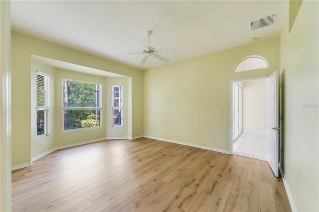 11291 Wine Palm Rd, Fort Myers, FL 33966 - unfurnished room featuring baseboards, visible vents, light wood-style floors, and a ceiling fan