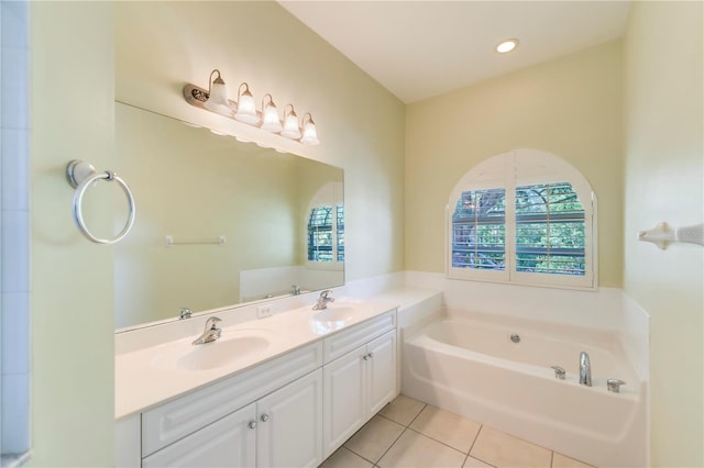 11291 Wine Palm Rd, Fort Myers, FL 33966 - full bath featuring a garden tub, a healthy amount of sunlight, tile patterned floors, and double vanity