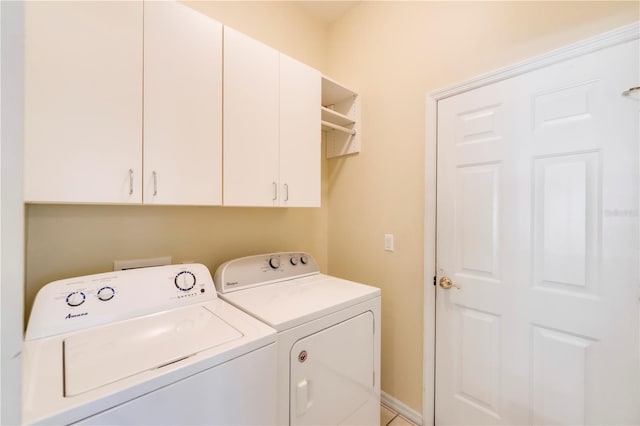 11291 Wine Palm Rd, Fort Myers, FL 33966 - clothes washing area featuring washing machine and clothes dryer, cabinet space, and baseboards