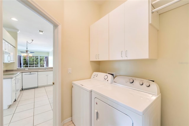 11291 Wine Palm Rd, Fort Myers, FL 33966 - laundry room with washer and clothes dryer, light tile patterned floors, a sink, a ceiling fan, and cabinet space