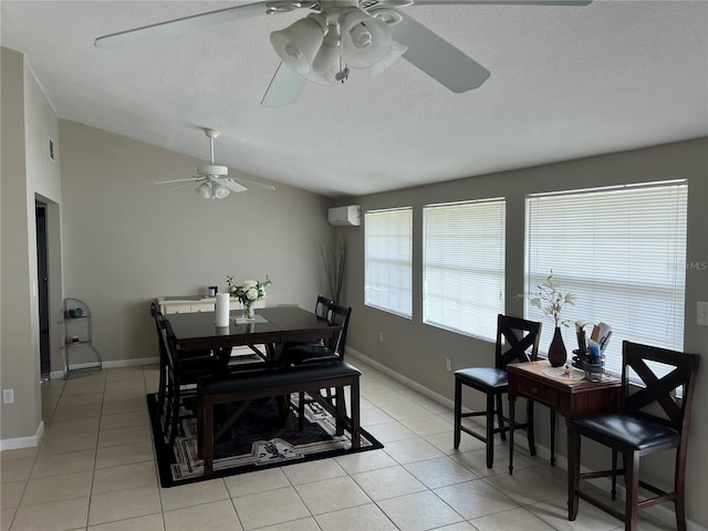 dining room with lofted ceiling, light tile patterned floors, a textured ceiling, ceiling fan, and a wall mounted air conditioner