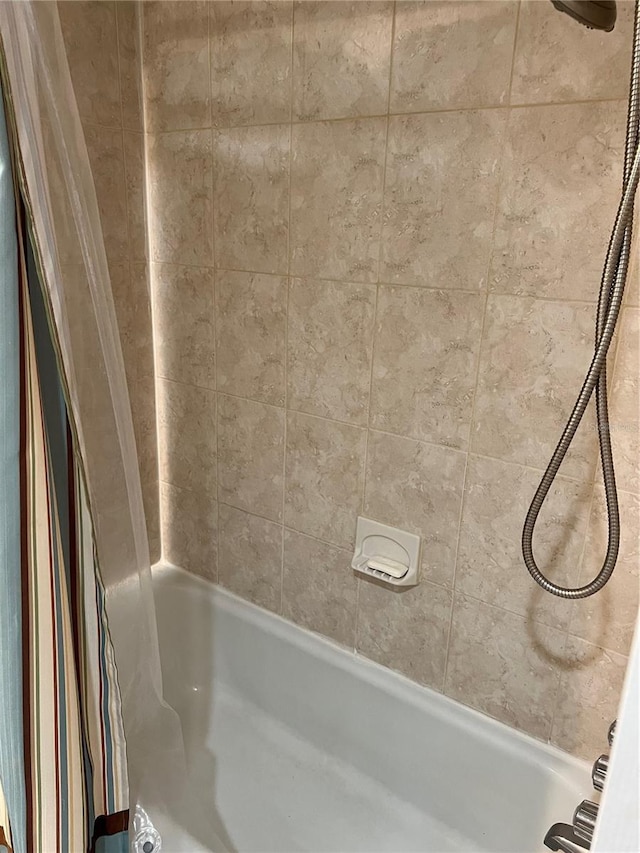 full bathroom featuring shower / bathtub combination with curtain