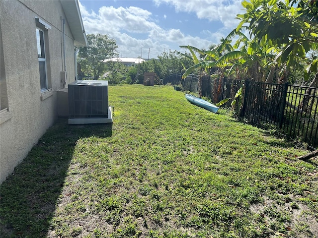 view of yard featuring cooling unit and a fenced backyard