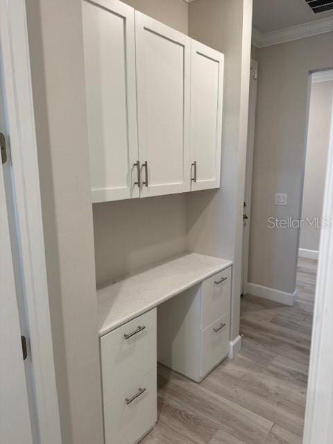 1263 Cicely Ct, North Port, FL 34289 - unfurnished office featuring crown molding, light wood finished floors, and baseboards