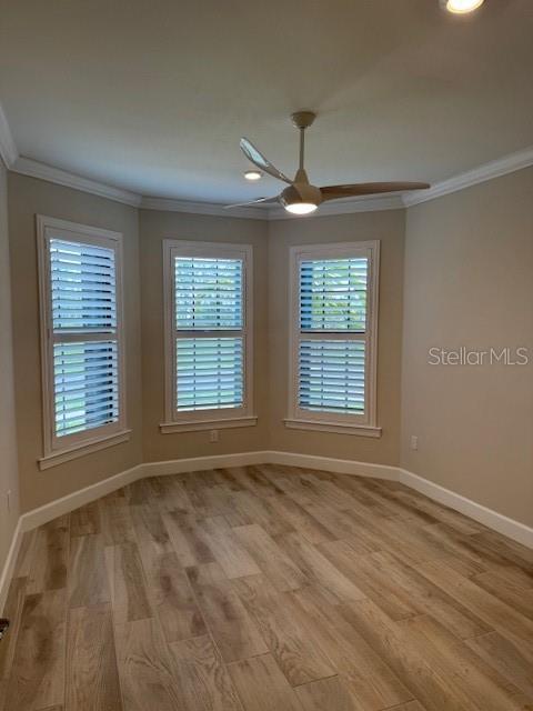 1263 Cicely Ct, North Port, FL 34289 - spare room with ornamental molding, a ceiling fan, baseboards, light wood finished floors, and recessed lighting