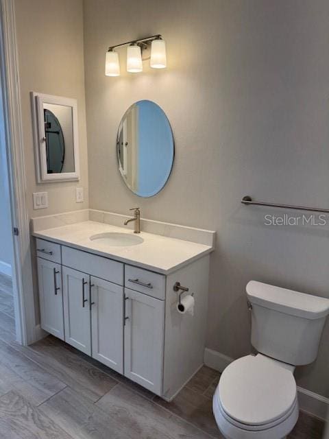 1263 Cicely Ct, North Port, FL 34289 - bathroom with vanity, toilet, and baseboards
