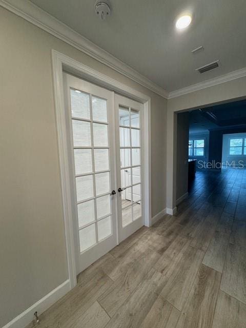 1263 Cicely Ct, North Port, FL 34289 - doorway with ornamental molding, french doors, wood finished floors, and baseboards