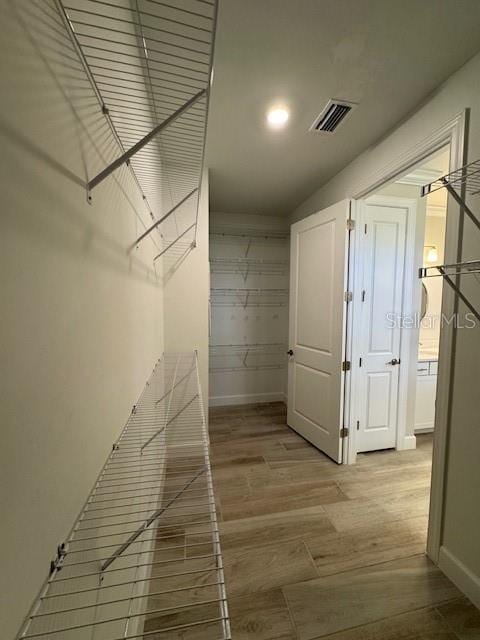 1263 Cicely Ct, North Port, FL 34289 - walk in closet featuring wood finished floors