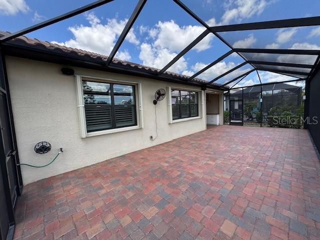 1263 Cicely Ct, North Port, FL 34289 - unfurnished sunroom featuring lofted ceiling