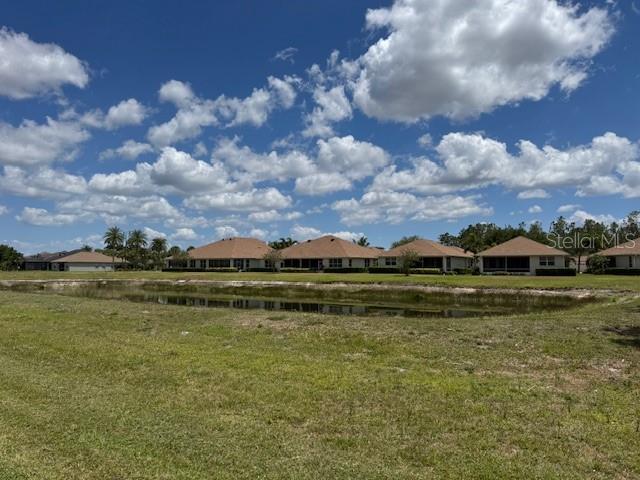1263 Cicely Ct, North Port, FL 34289 - view of grassy yard with a water view and a residential view