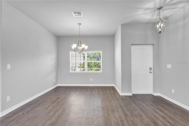 20241 Lorette Ave, Port Charlotte, FL 33954 - interior space featuring dark wood-type flooring, baseboards, a notable chandelier, and visible vents