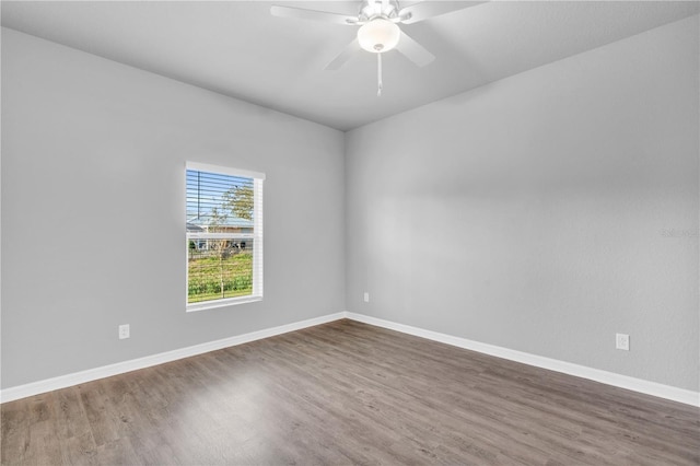 20241 Lorette Ave, Port Charlotte, FL 33954 - unfurnished room with baseboards, a ceiling fan, and wood finished floors