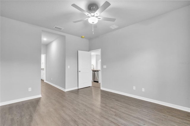 20241 Lorette Ave, Port Charlotte, FL 33954 - empty room featuring visible vents, ceiling fan, and wood finished floors