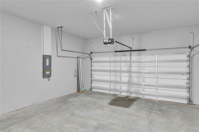 20241 Lorette Ave, Port Charlotte, FL 33954 - garage featuring electric panel, a garage door opener, and concrete block wall